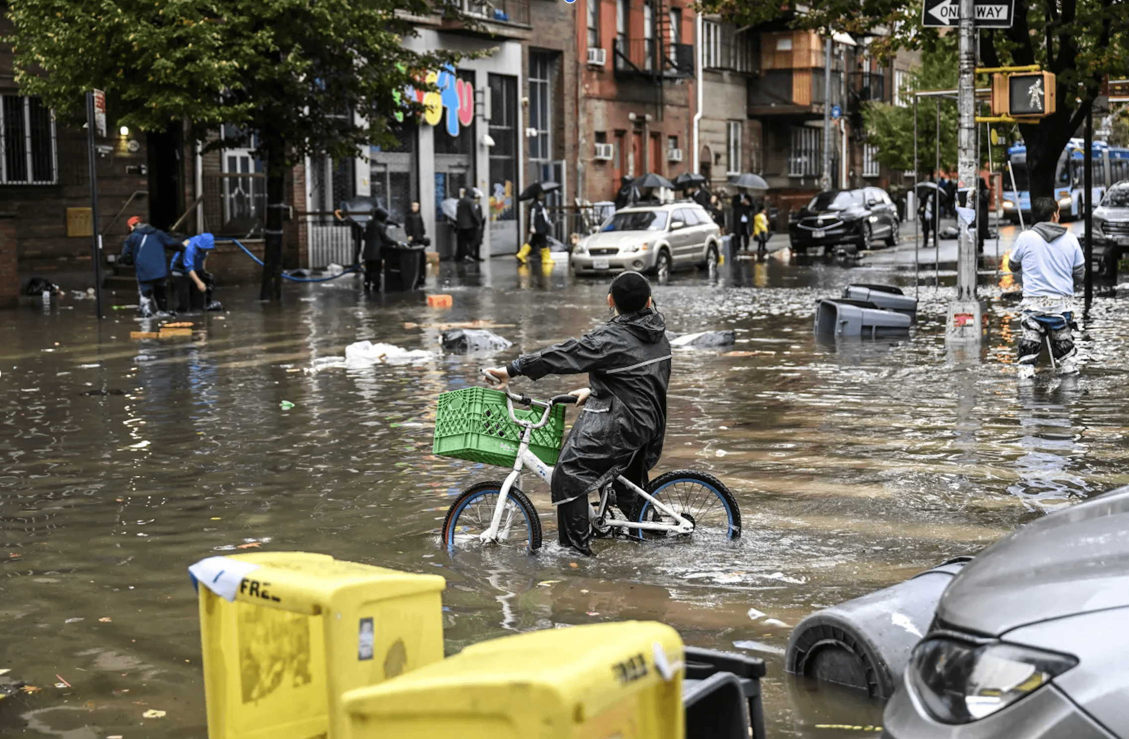 A biker attempts to navigate New York City’s flooded streets in September 2023. Fatih Aktas/Anadolu Agency/Getty Images